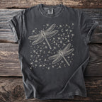 Charcoal t-shirt with two cream line-art dragonflies surrounded by dandelions, moons, and stars.