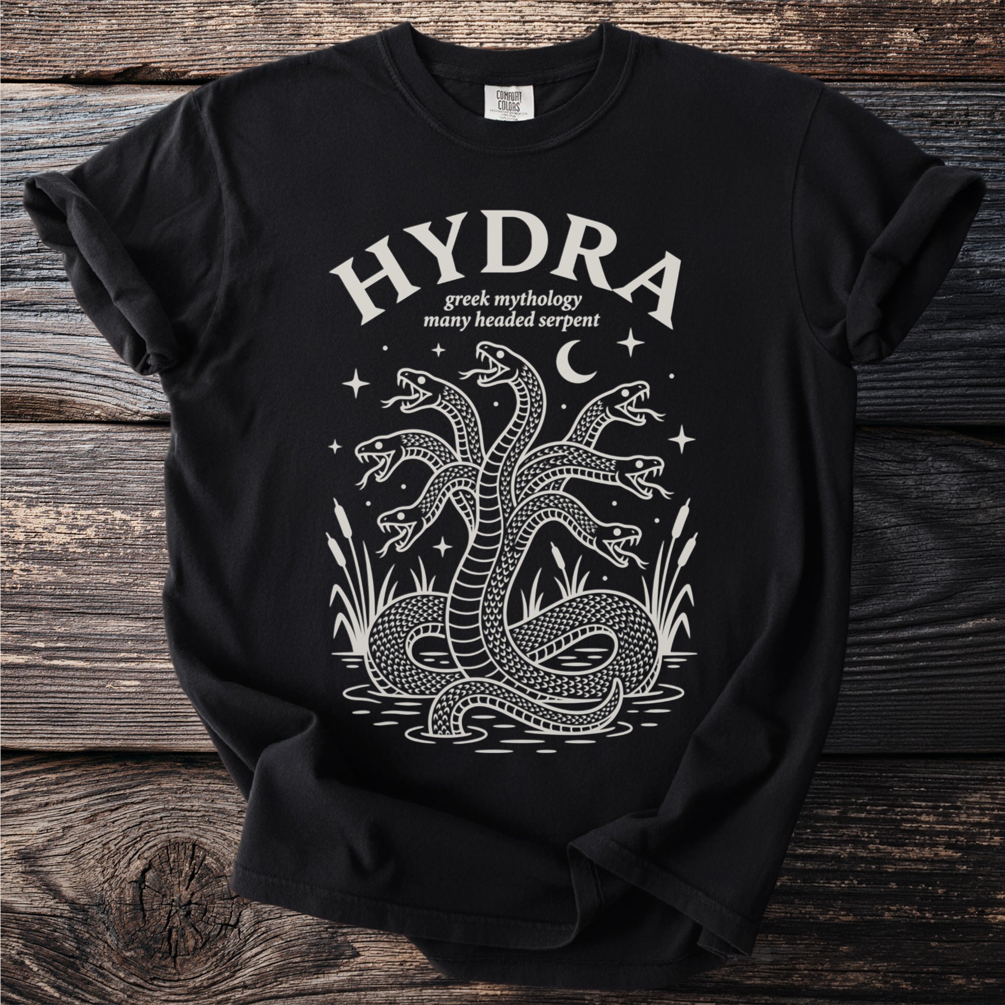 Black t-shirt with white print of a seven-headed hydra "greek mythology many headed serpent".