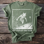 Green t-shirt with a werewolf graphic and the text "the evidence has teeth."