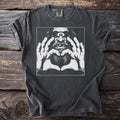 Black Comfort Colors t-shirt with graphic of a cyclops making a heart shape with its hands.