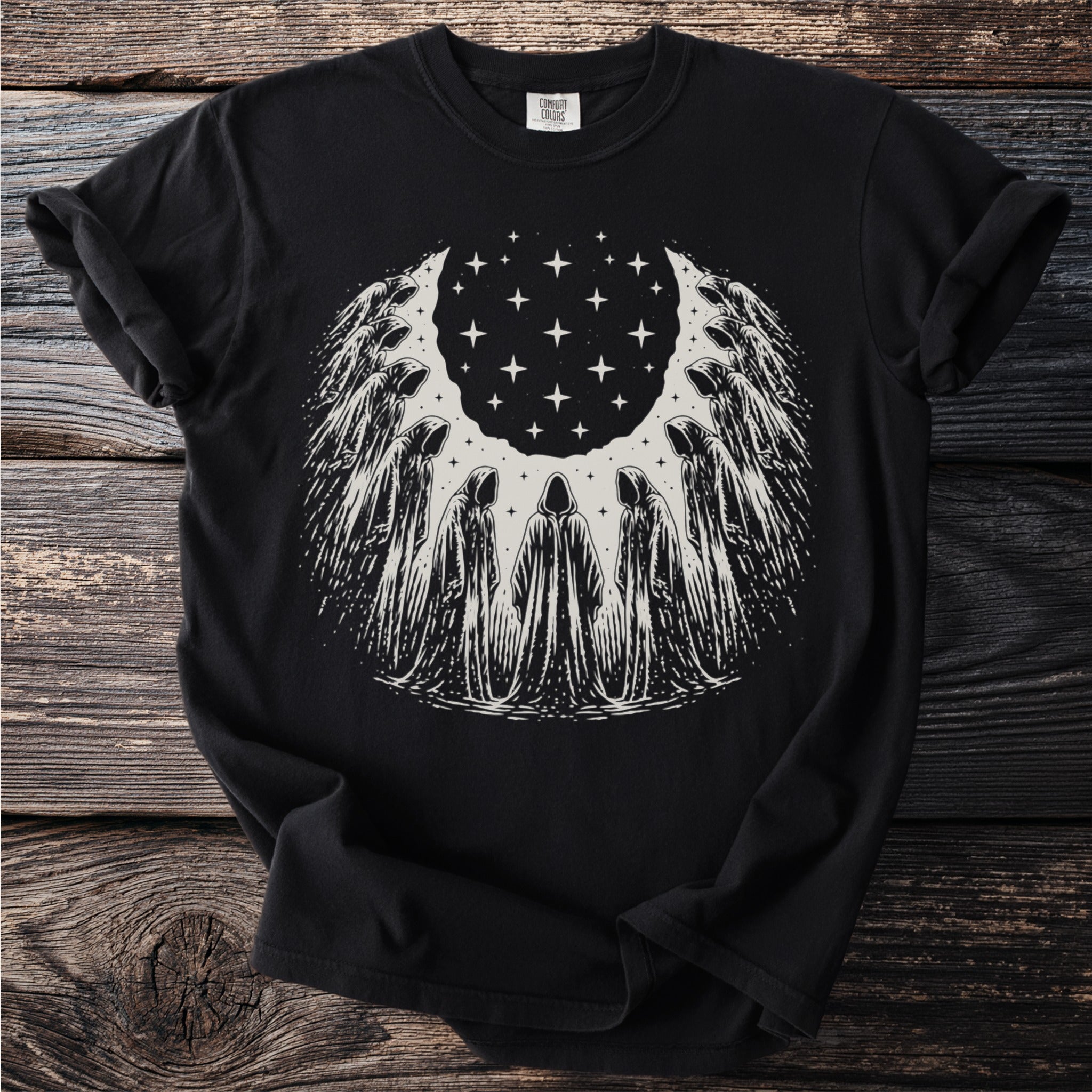 Black t-shirt with a circular design of hooded figures around stars.