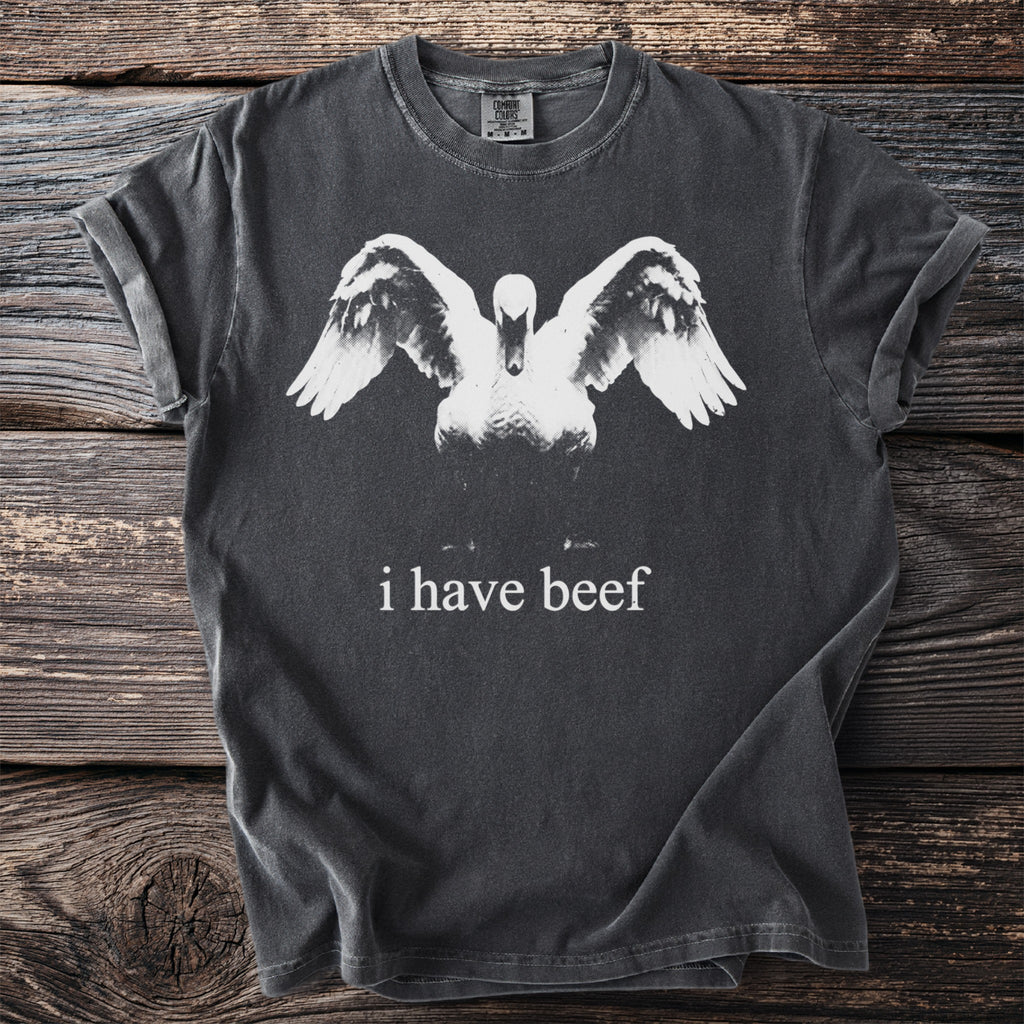 Dark grey t-shirt with a swan graphic and text "i have beef".