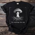 Black t-shirt with a distressed graphic of a mushroom and roots, and text "i'm rooting for you".