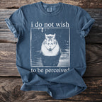 Blue t-shirt with text "i do not wish to be perceived" and a capybara.
