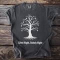 Dark grey t-shirt with white graphic of a tree with skulls and lights, text "Silent Night, Unholy Night".