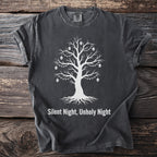 Dark grey t-shirt with white graphic of a tree with skulls and lights, text "Silent Night, Unholy Night".