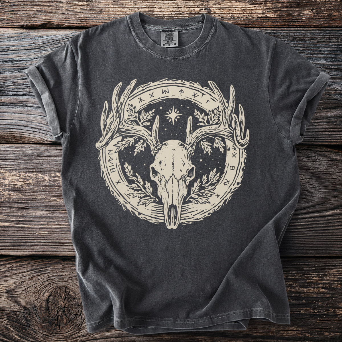 Dark grey t-shirt with a circular graphic featuring a deer skull, antlers, leaves, and runes.