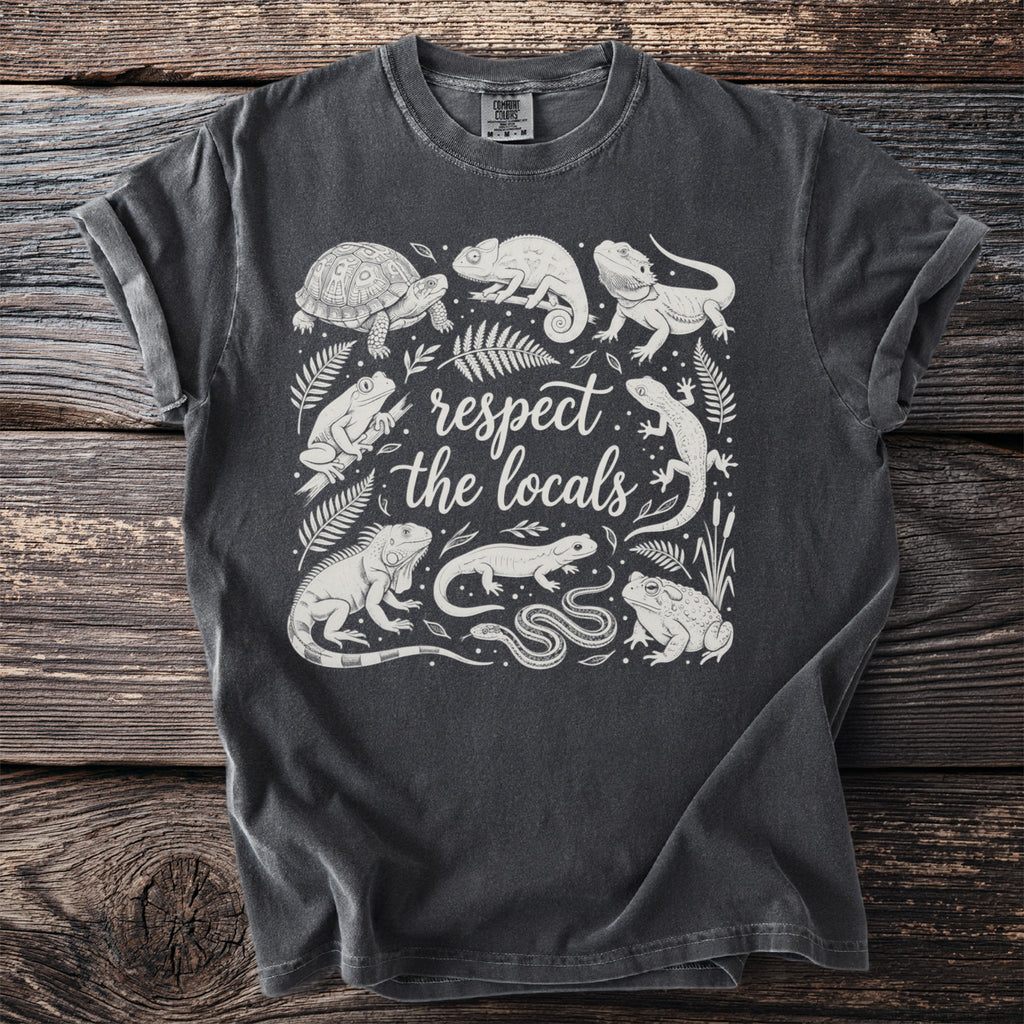 Dark grey t-shirt with white illustration of assorted reptiles and amphibians and text.
