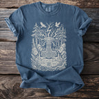 Blue t-shirt featuring a detailed Thor's Hammer design with trees, runes, and birds.