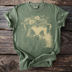 Green t-shirt with a cream-colored graphic of a hedgehog wearing a flower crown.