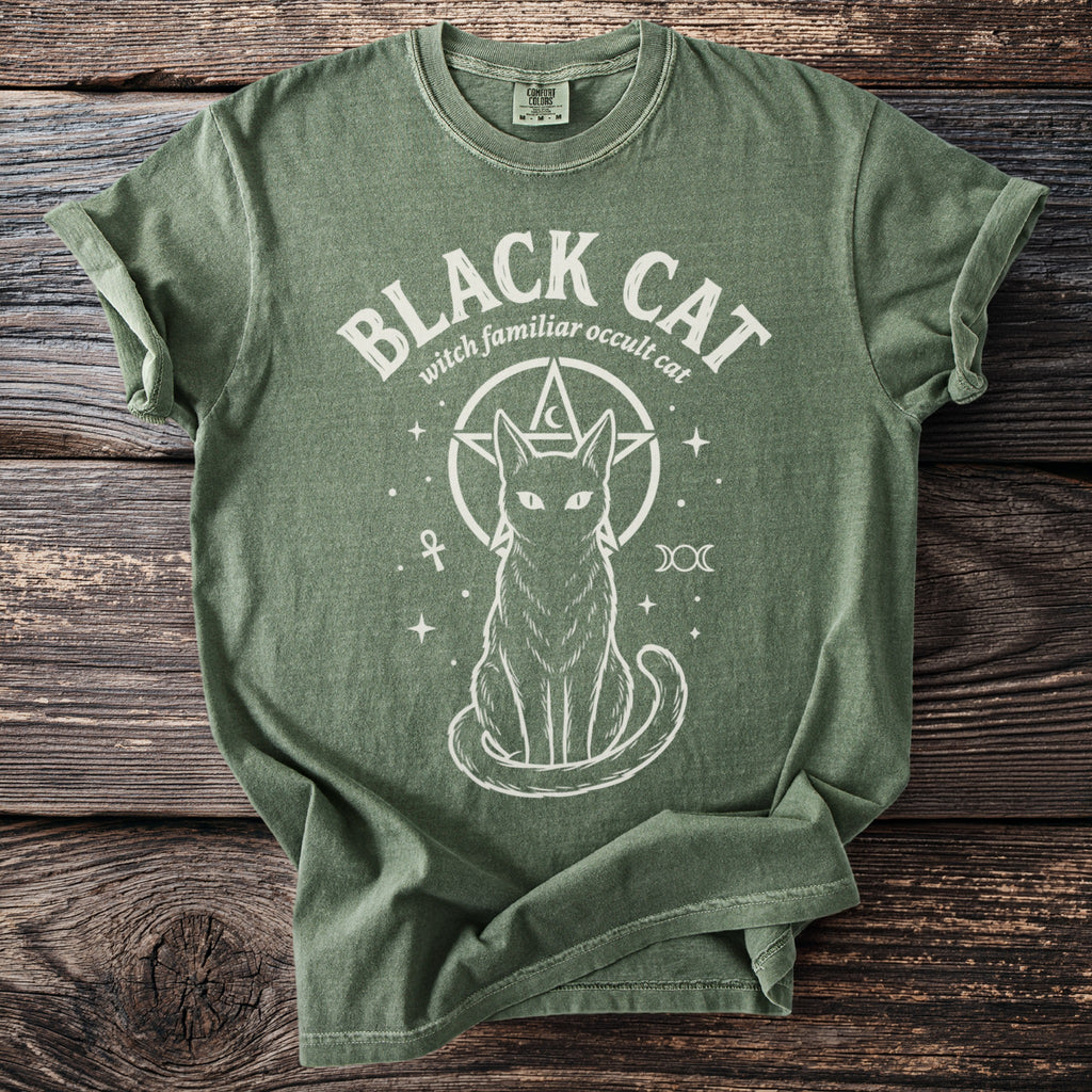 Green t-shirt with white graphic of a cat within a pentagram, text "BLACK CAT witch familiar occult cat".