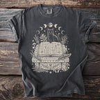 Black cat sitting on an open book surrounded by magical symbols, plants, and moons.