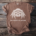 Brown t-shirt with white jumping spider graphic and text "too weird to perish".