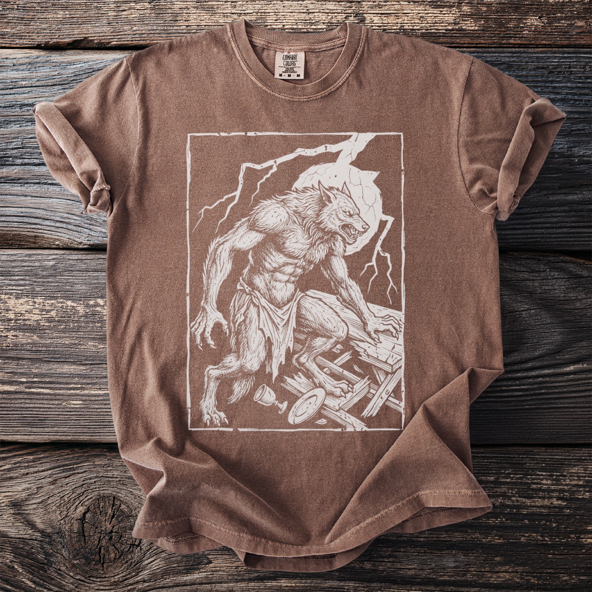 Brown t-shirt with white graphic of a snarling werewolf standing on broken wood.