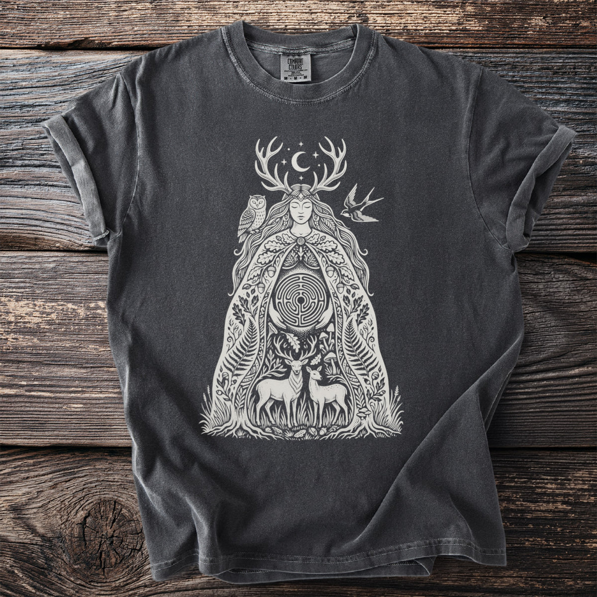Dark grey t-shirt with a white illustration of a forest goddess, deer, owl, and maze.