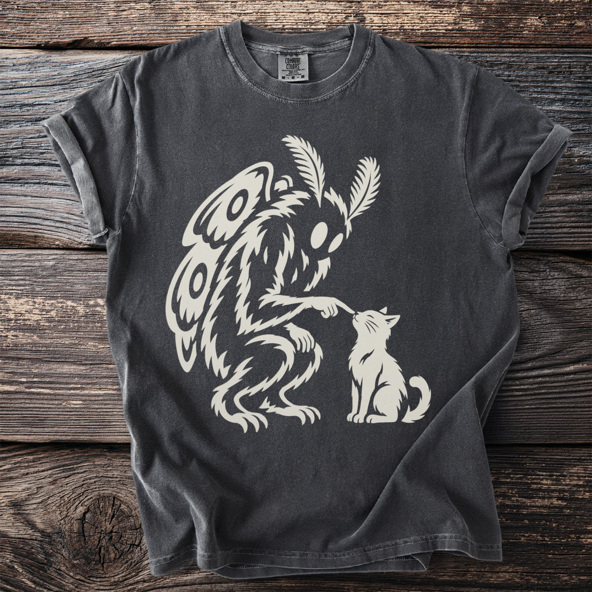 Dark grey t-shirt with a cream graphic of a mothman touching a cat's nose.