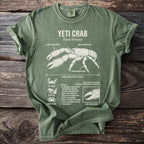Green t-shirt with a white diagram of the Yeti Crab and its biological facts.