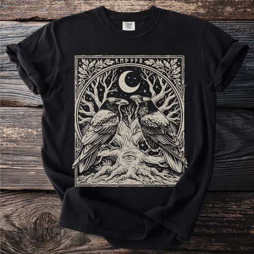 Black t-shirt with a graphic featuring two ravens, a tree, a crescent moon, and runes.