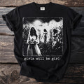 T-shirt graphic shows three ghostly figures in a cornfield with text "girls will be girl".