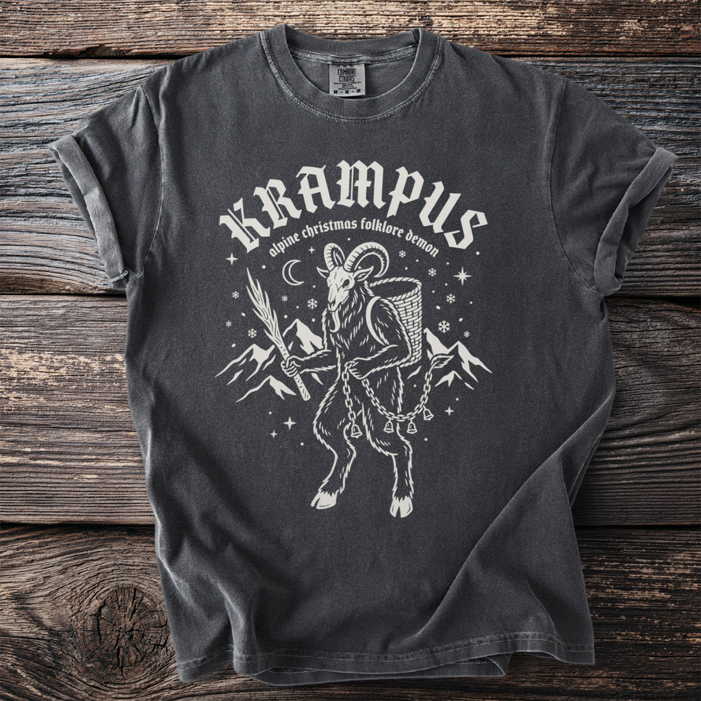 Dark gray t-shirt featuring "Krampus alpine Christmas folklore demon" and a goat-like figure.
