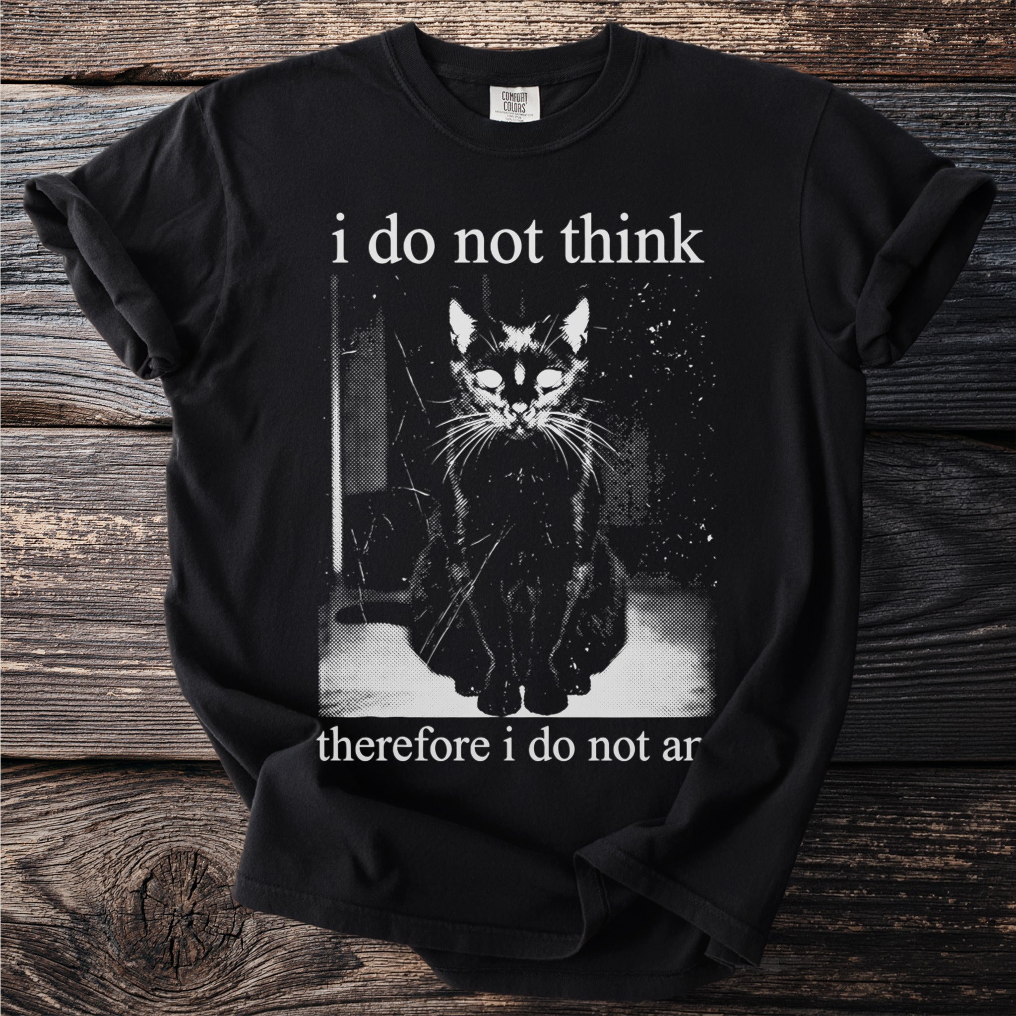 Black t-shirt with a seated black cat graphic and white text "i do not think therefore i do not ar".
