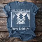 Blue t-shirt with "god forbid women have hobbies" and witch graphic.