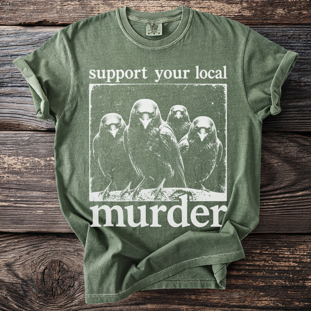 Green t-shirt with a graphic of four crows and text: "support your local murder."