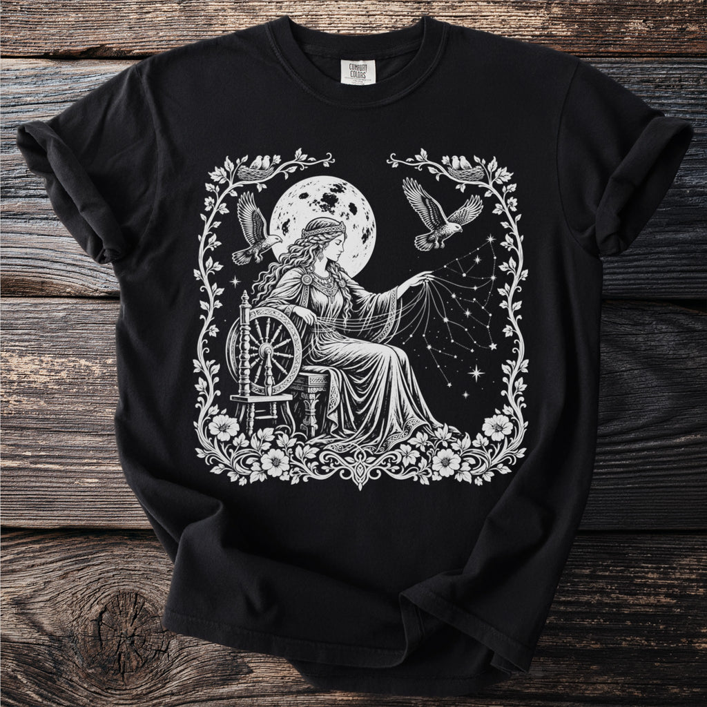 Black t-shirt with a white graphic of a woman spinning constellations by a full moon.