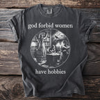 T-shirt with "god forbid women have hobbies" text and a circular graphic of women reading and writing.