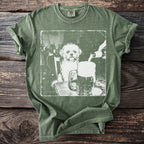 Green t-shirt with graphic of dog sitting at a table with a beer being poured.