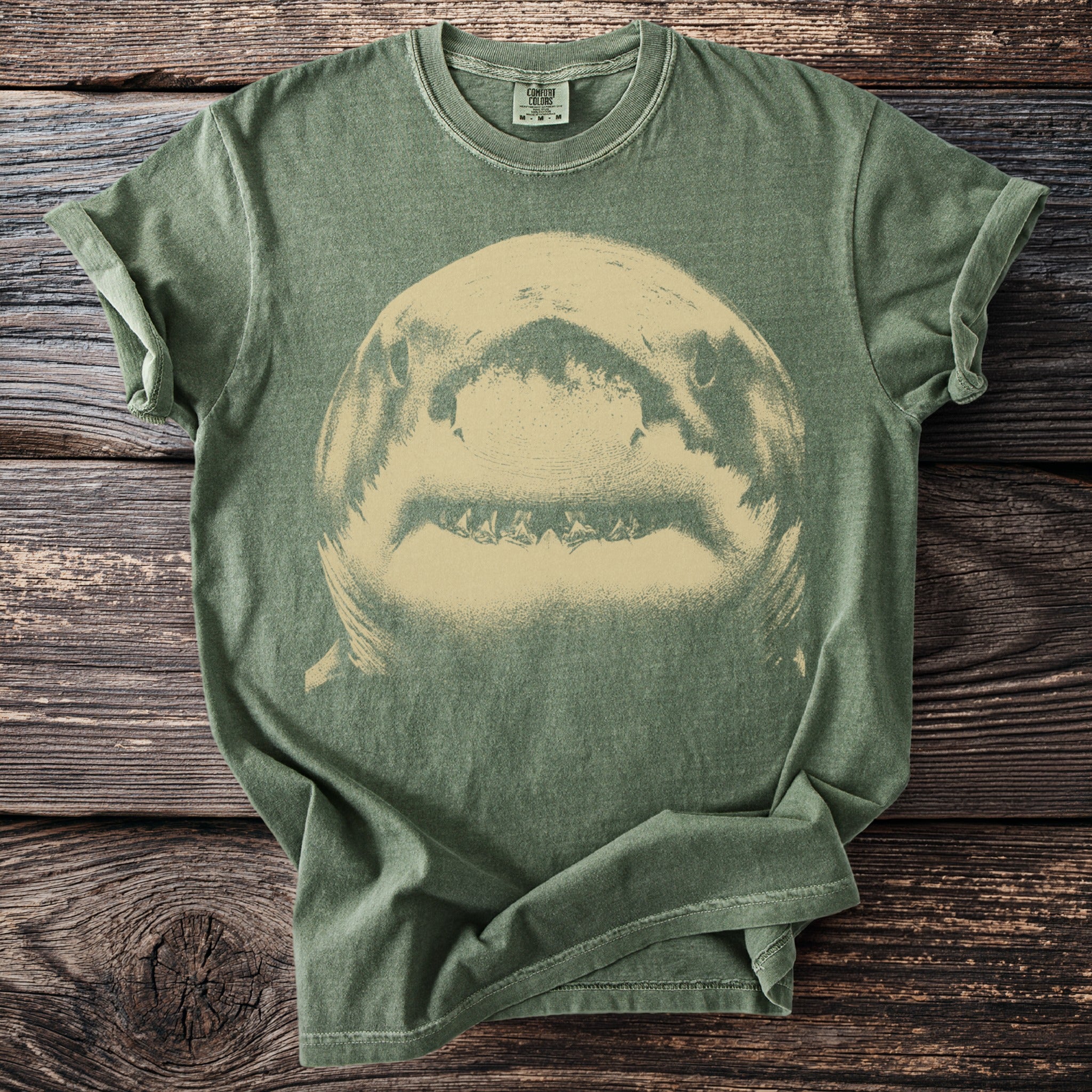 Green t-shirt with a distressed shark graphic and Comfort Colors tag.