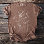 Brown t-shirt with a detailed white line drawing of Krampus and bells.