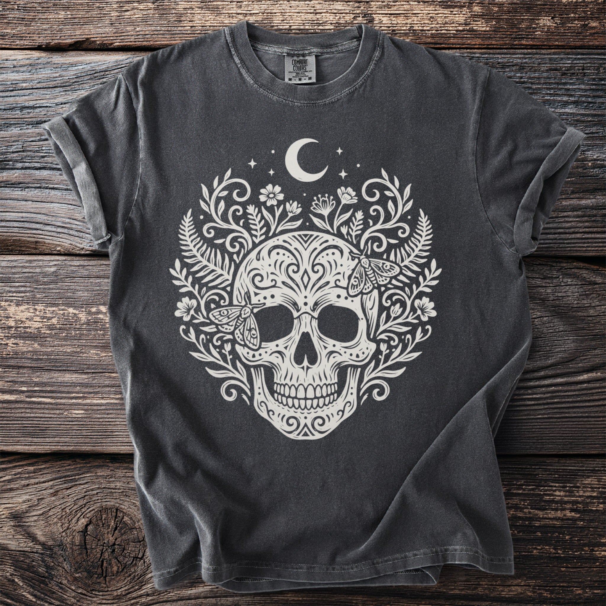 Gray t-shirt with white skull, moon, stars, floral, and moth design.