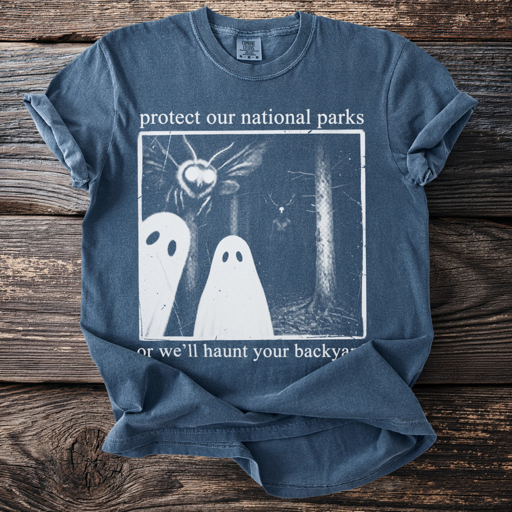 T-shirt with white text and graphic: protect our national parks or we'll haunt your backyard.