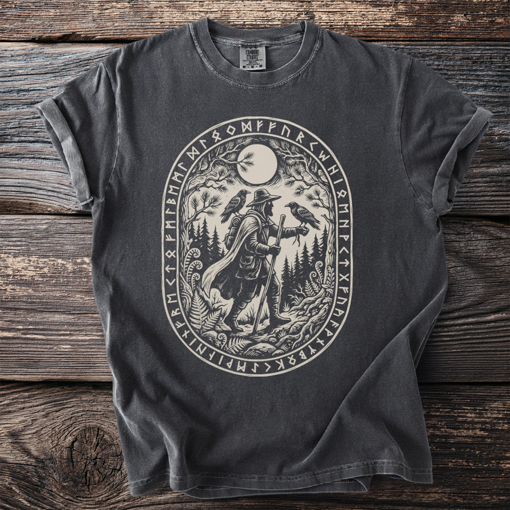 T-shirt with oval print of a traveler with two ravens under a moon, surrounded by runes.