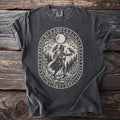 Dark gray t-shirt showing Odin the Runic Wanderer with two ravens, moon, and runes.