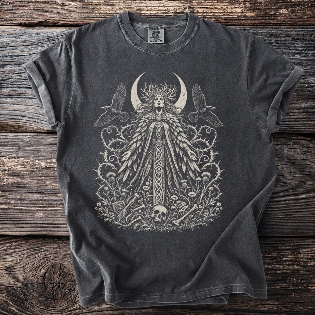Dark grey t-shirt with a graphic of a woman, crescent moon, birds, and bones.