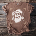 Brown t-shirt with graphic of skull wearing a beanie with roses and beard.