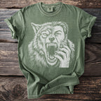 Green t-shirt with a white graphic of a werewolf's face and hand.
