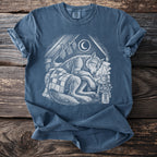 T-shirt with white linocut-style illustration of a sleeping wolf under a crescent moon.