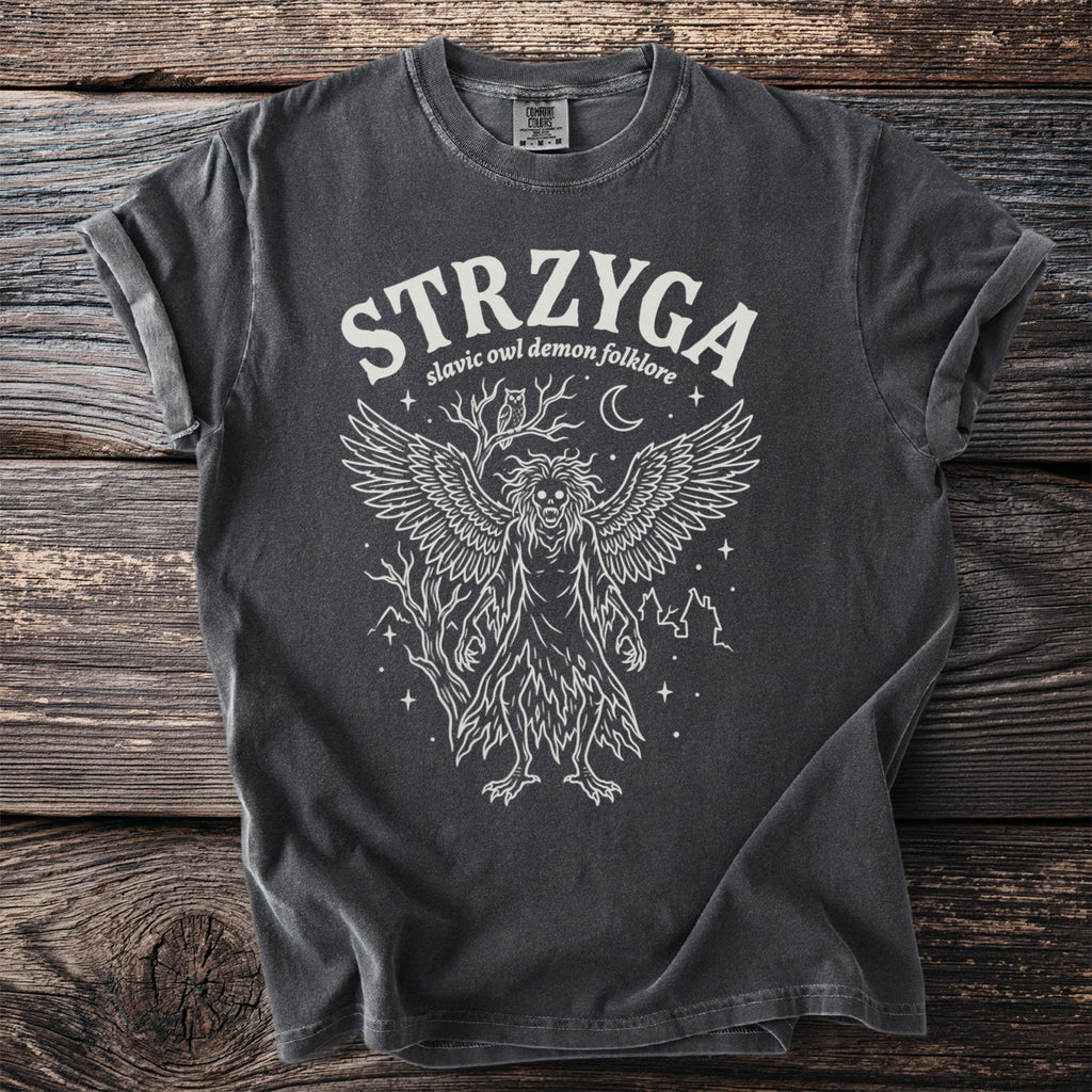 T-shirt with white linework of a winged demon, owl, moon, and trees.
