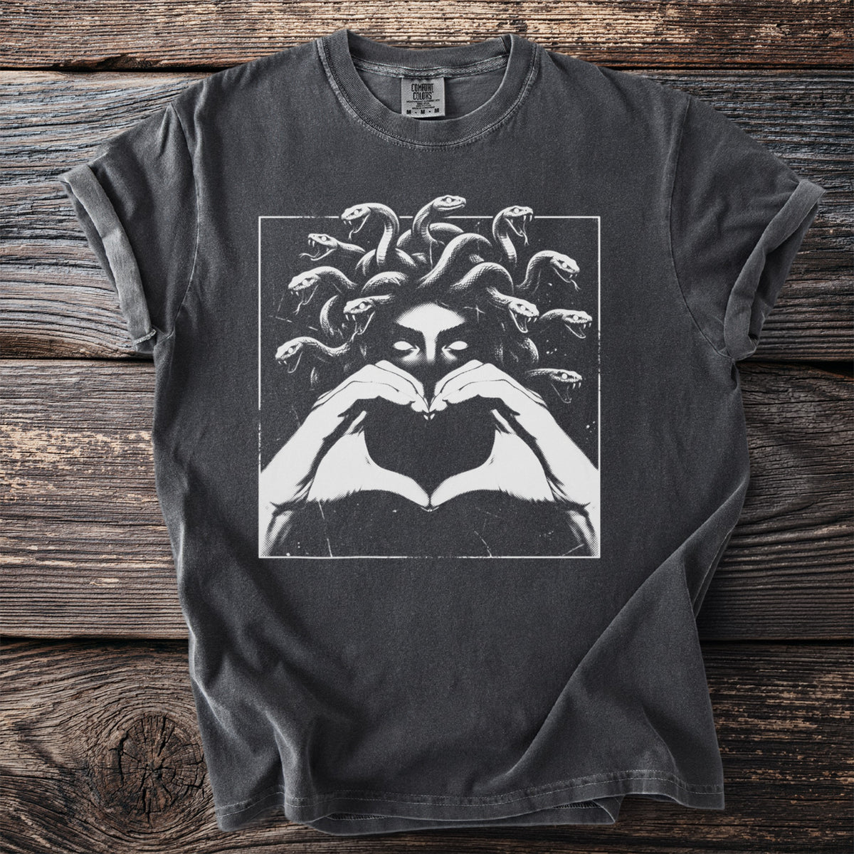 T-shirt with Medusa graphic making a heart shape with hands.