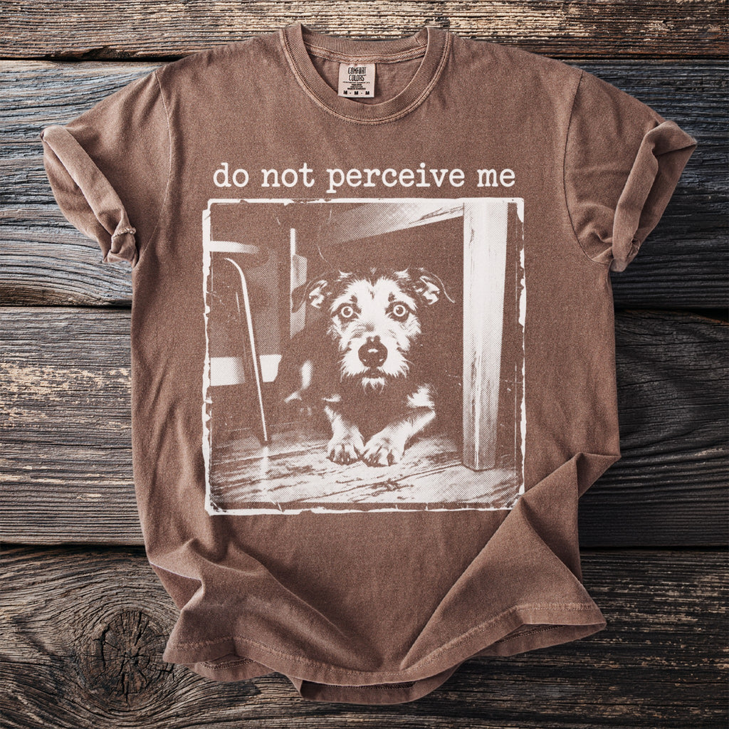 Brown t-shirt with a distressed graphic of a dog and text "do not perceive me".