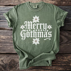 Green t-shirt with white "Merry Gothmas" text, skulls, and poinsettias.