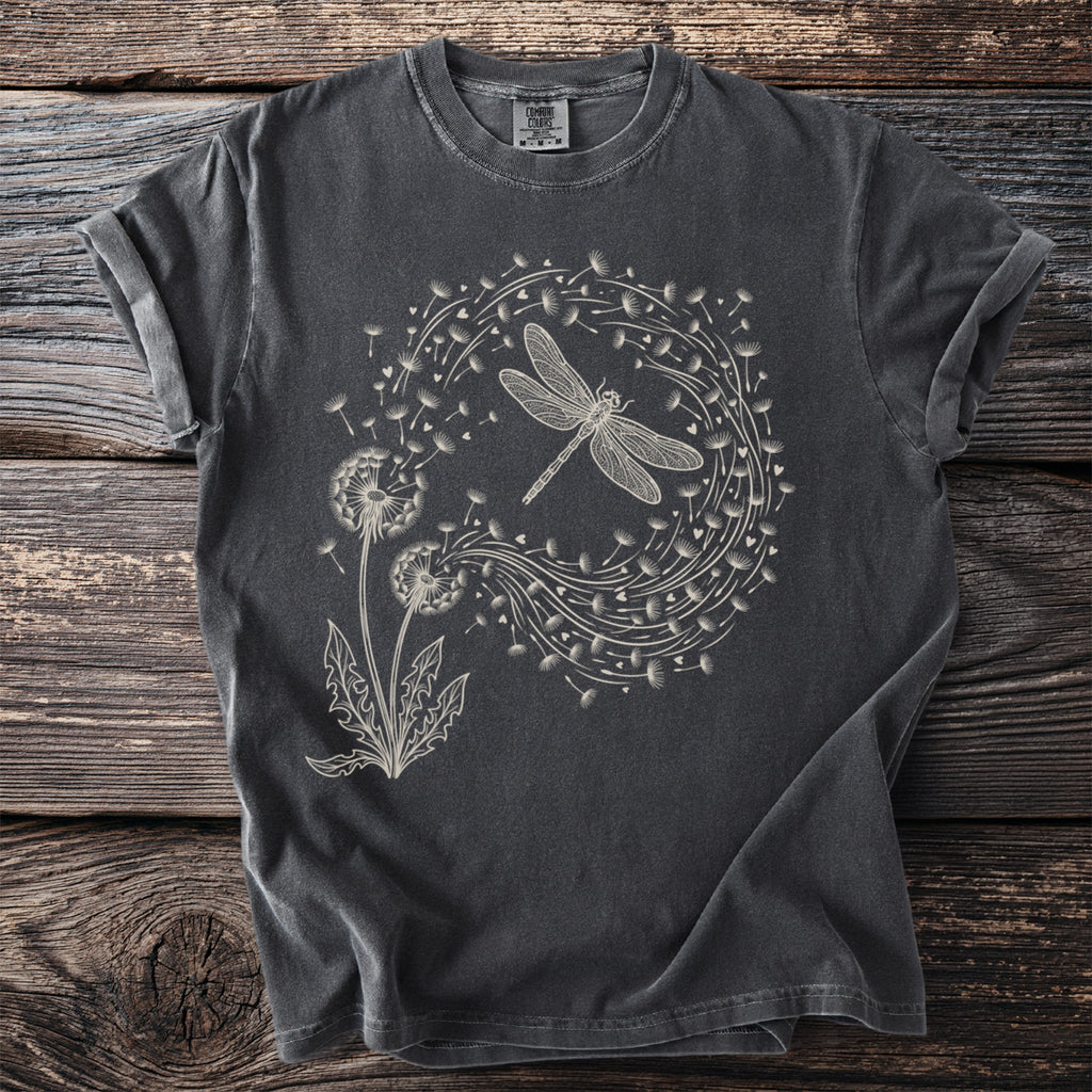 Dark gray t-shirt with a line art print of a dragonfly and dandelions.