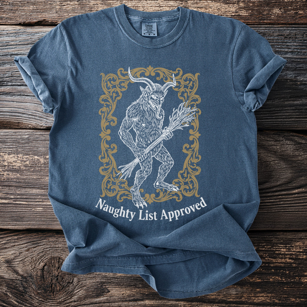 Blue t-shirt with vintage Krampus illustration and "Naughty List Approved" text.