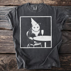 Black t-shirt with a vintage print of a possum wearing a party hat at a table.