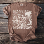 Brown t-shirt graphic with woodland animals and text "respect the locals."
