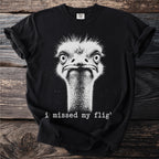 Black t-shirt with white graphic of an ostrich's face and text "i missed my flig'".
