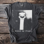 T-shirt with black and white graphic of an ostrich head and the text "i missed my flight".